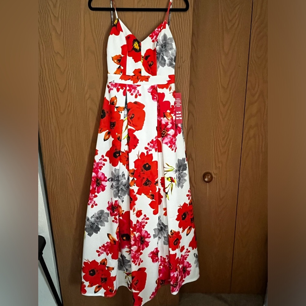 White dress with red and pink flowers all over, Open back. Prom like dress.
